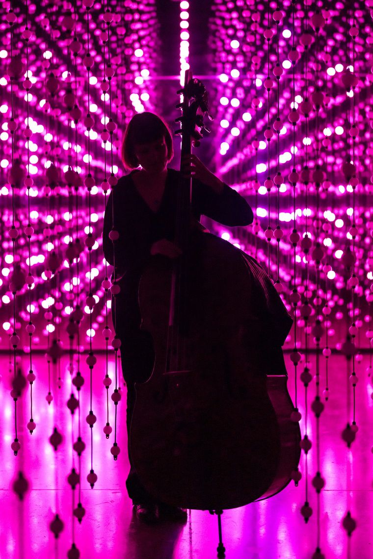 A bass player at a hosted night
